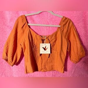 Paper crane NWT size small orange puffed sleeve crop top. Key hole with bow
